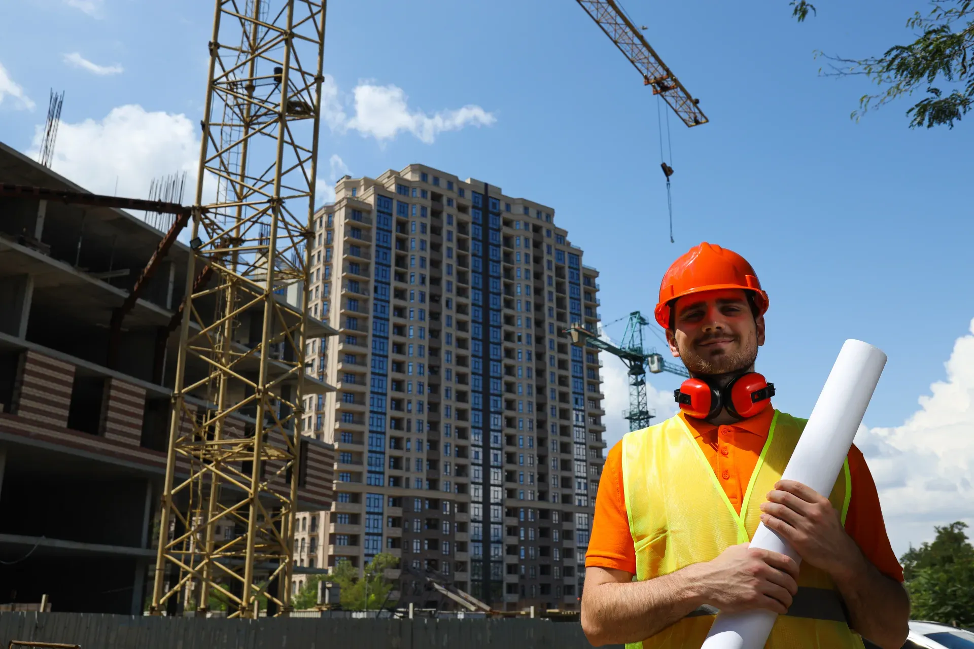 Civil engineer in a safety helmet on a construction site