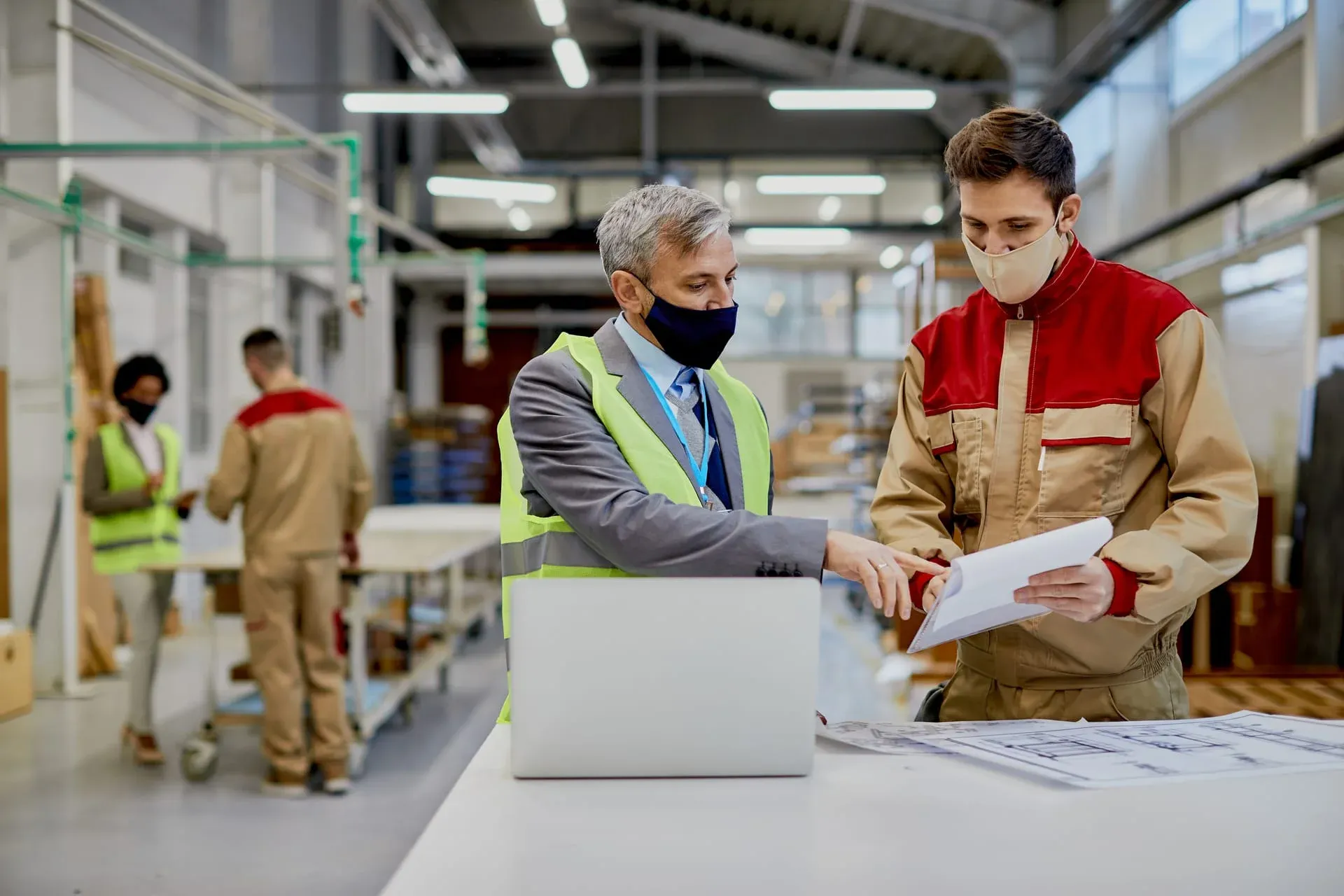 Engineer reviewing maintenance records
