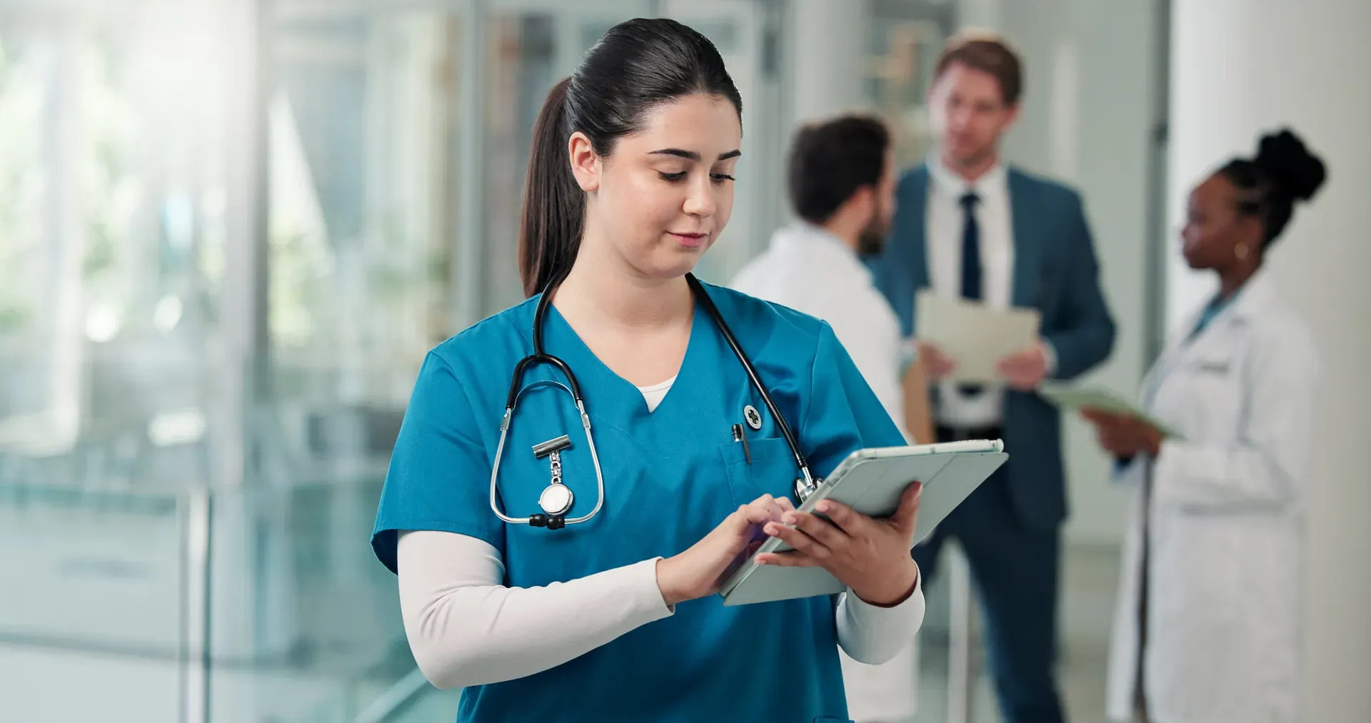 Clinician completing a safety round on a tablet