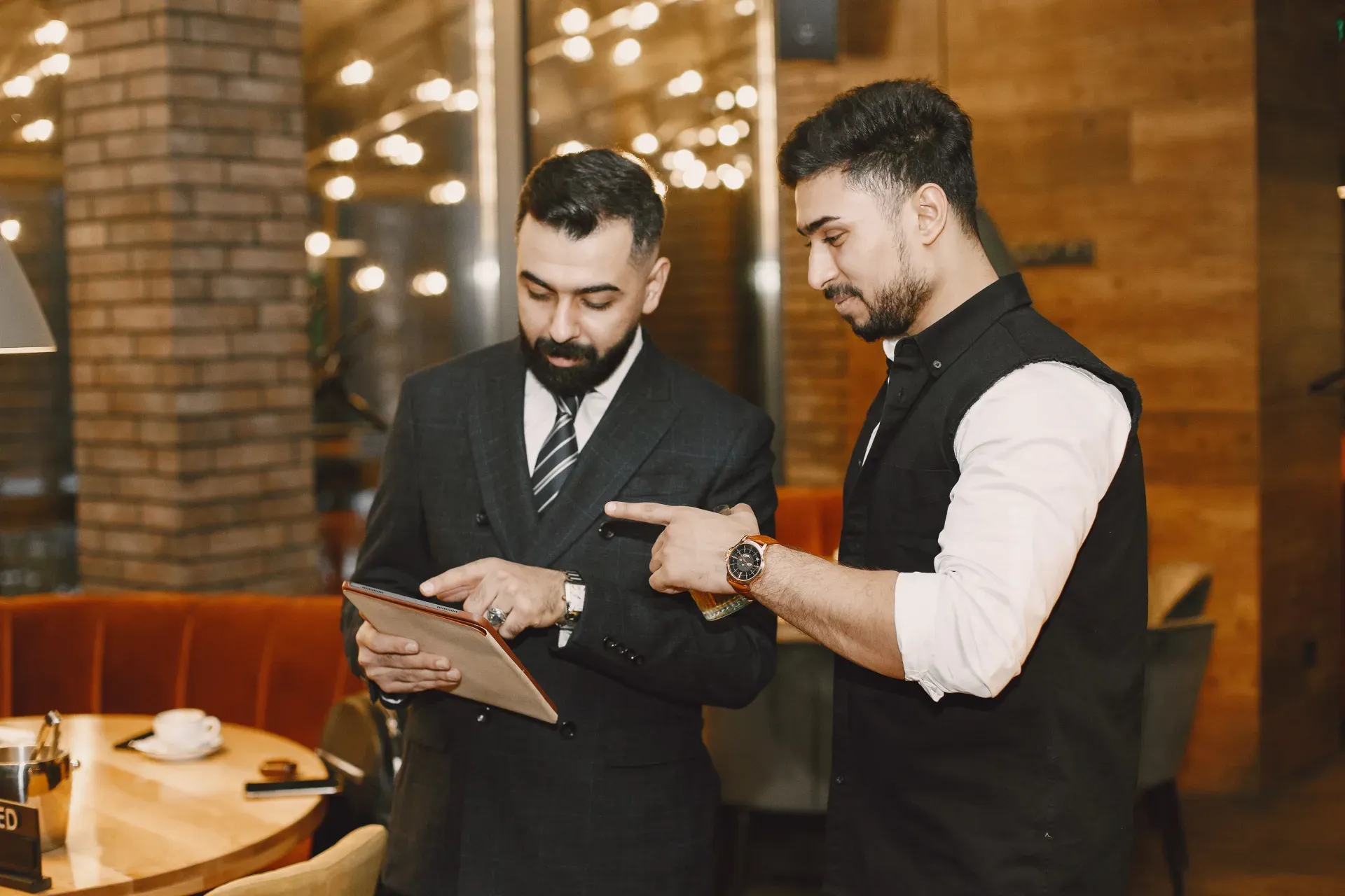 Hospitality staff serving guests in a restaurant