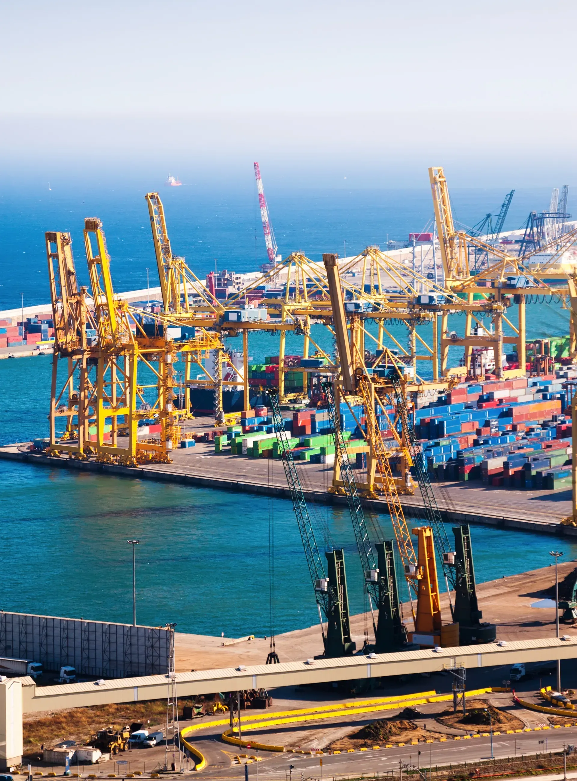 Industrial port of Barcelona with cargo cranes and shipping containers