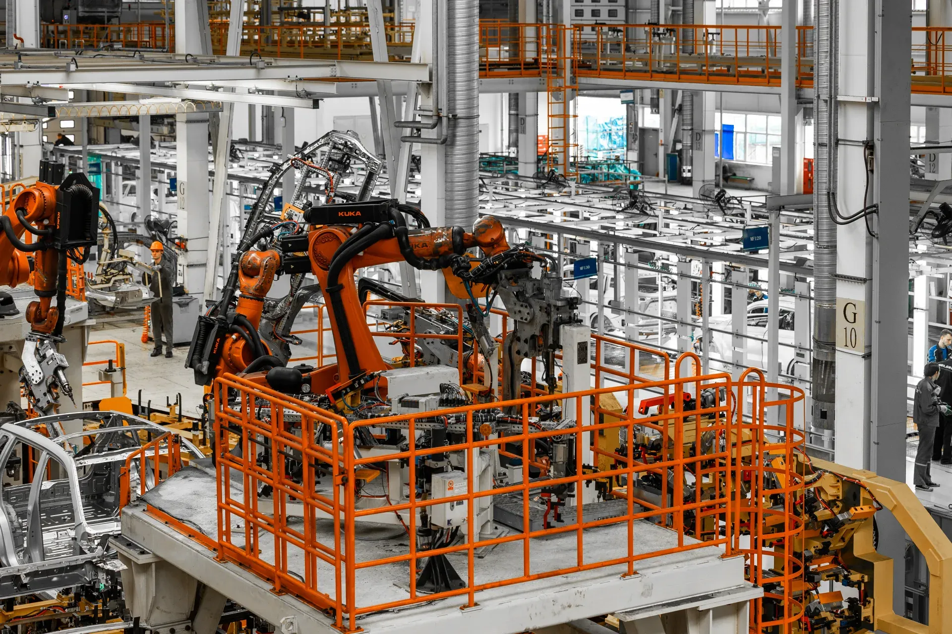 Automated welding robots on a modern automobile assembly line